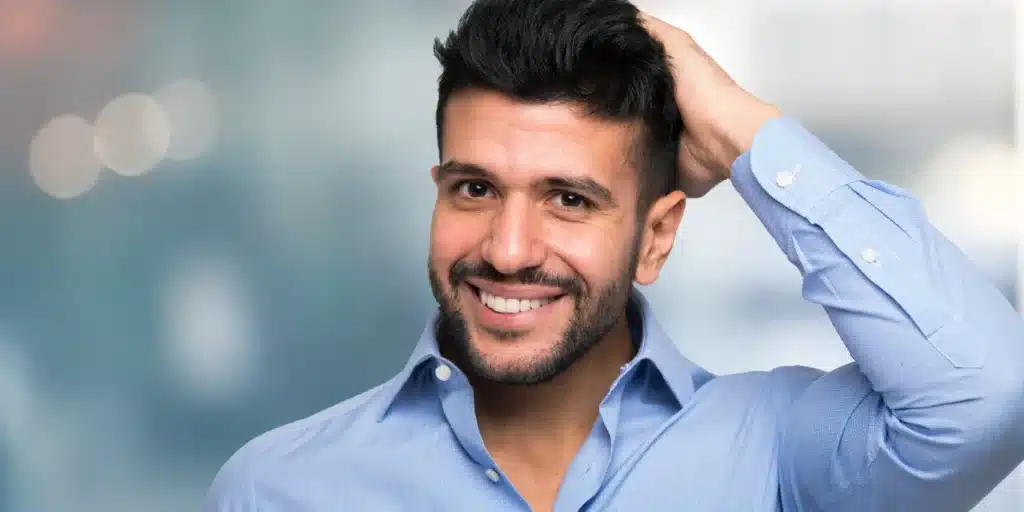 Man touching his hair